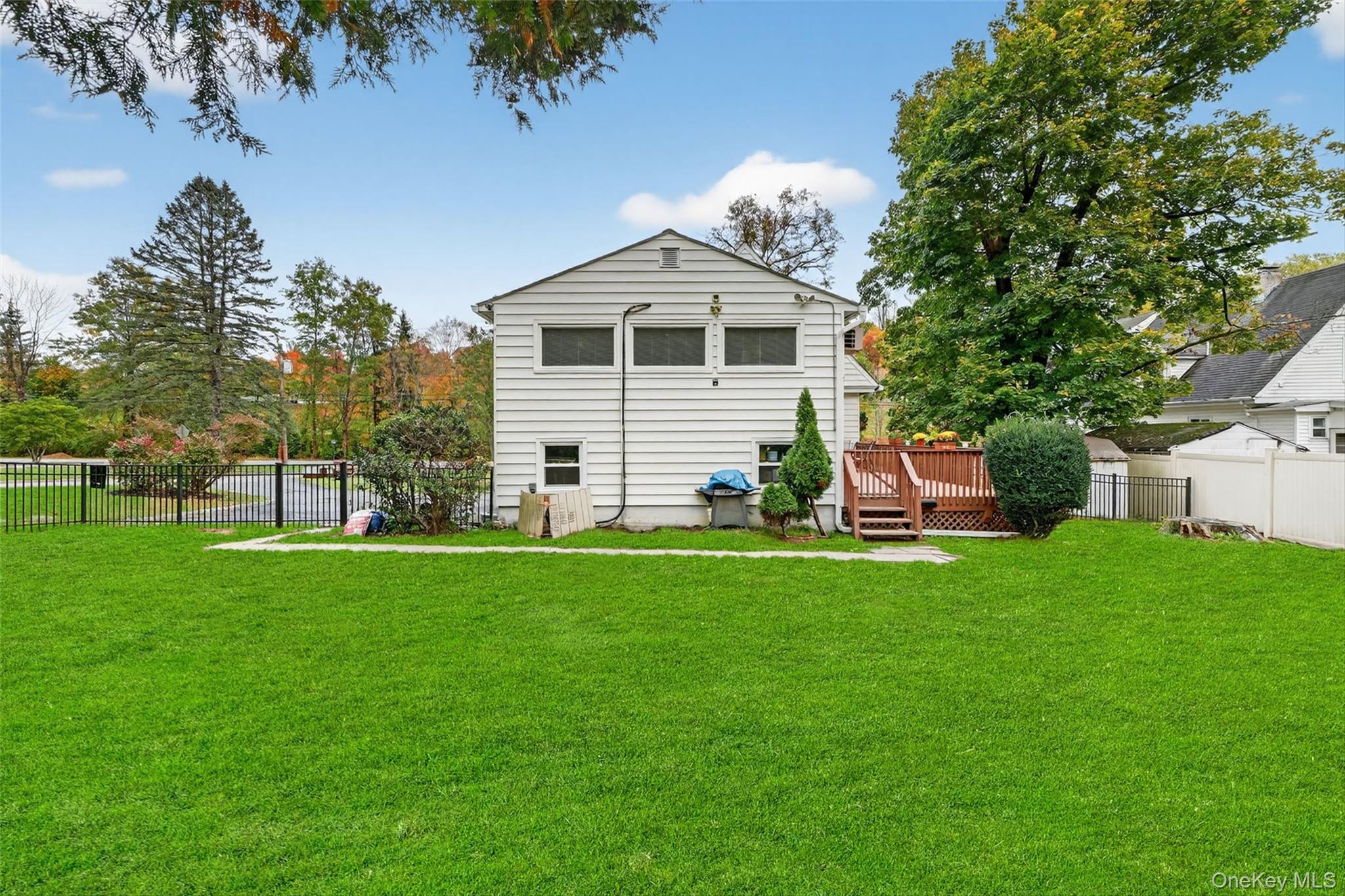 134 Dalmeny Road Briarcliff Manor, NY 10510 - Photo 39 of 44 a front view of a house with a garden