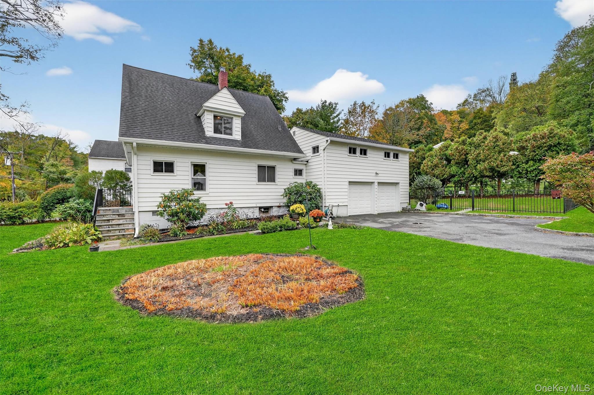 134 Dalmeny Road Briarcliff Manor, NY 10510 - Photo 4 of 44 a view of a house with a yard and potted plants