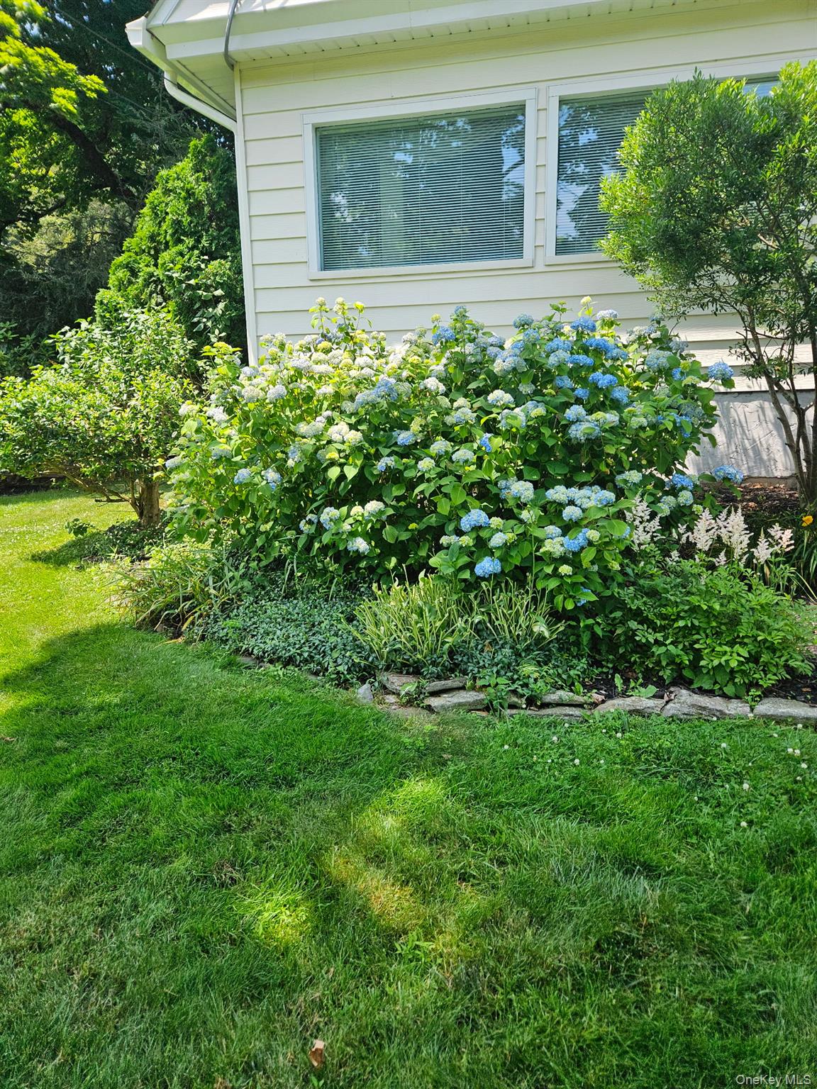 134 Dalmeny Road Briarcliff Manor, NY 10510 - Photo 44 of 44 a view of a house with a garden