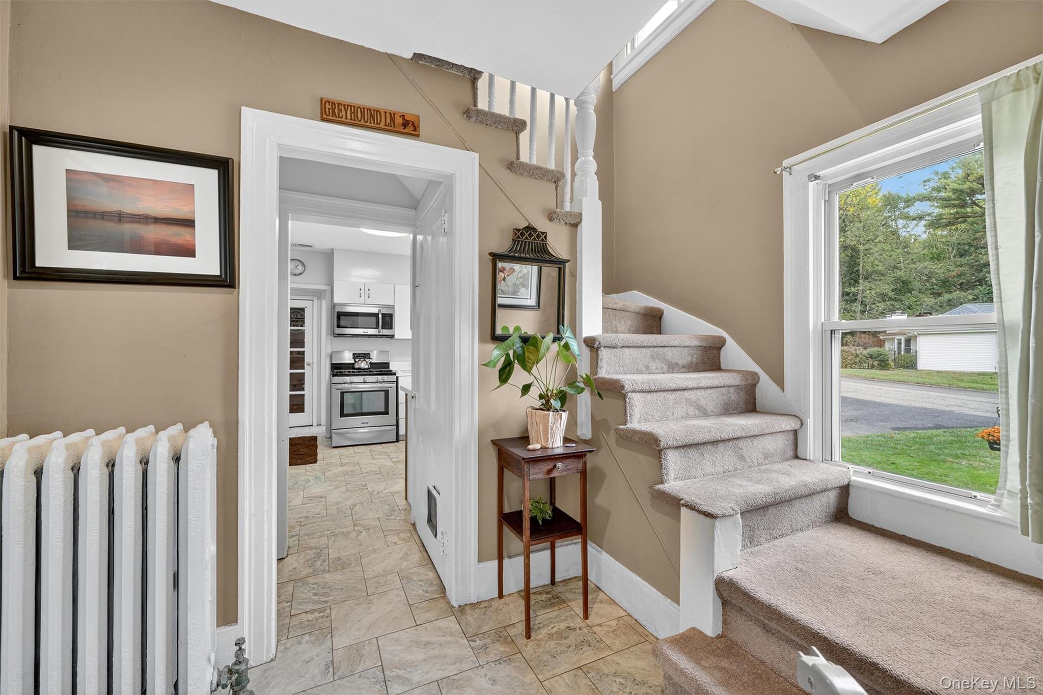 134 Dalmeny Road Briarcliff Manor, NY 10510 - Photo 7 of 44 a living room with furniture a lamp and large windows