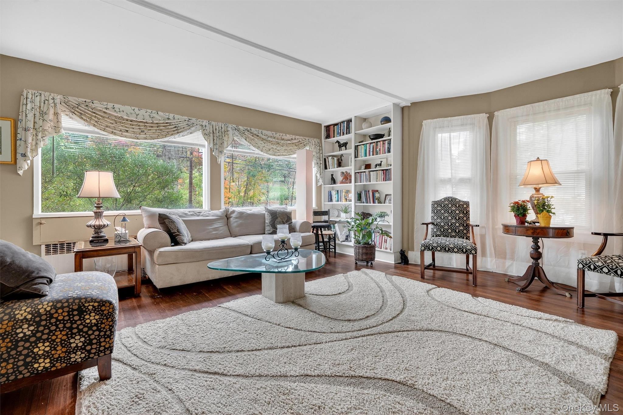 134 Dalmeny Road Briarcliff Manor, NY 10510 - Photo 8 of 44 a living room with furniture and a large window
