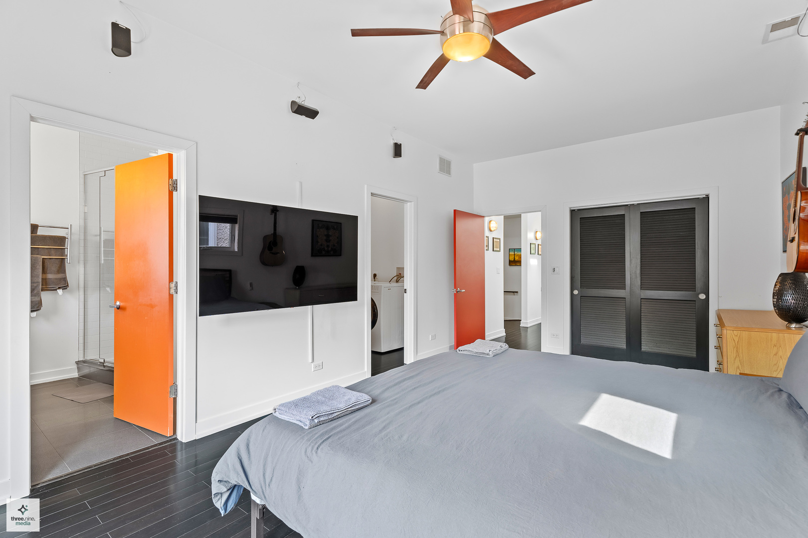 3036 North Gresham Avenue Chicago, IL 60618 - Photo 14 of 31 a bedroom with a bed and a flat screen tv