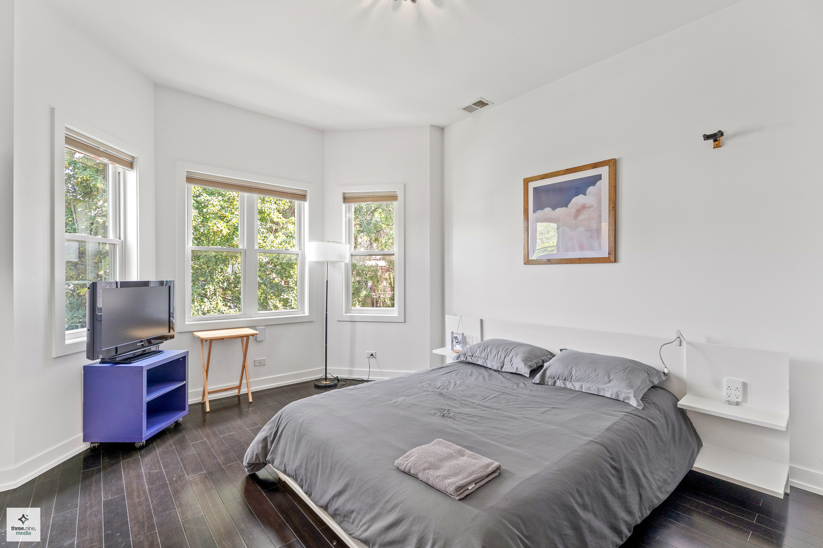 3036 North Gresham Avenue Chicago, IL 60618 - Photo 18 of 31 a bedroom with a bed and wooden floor