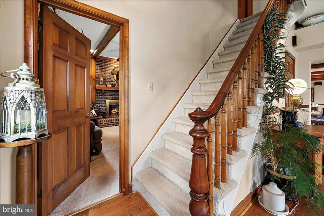 a view of hall way with furniture