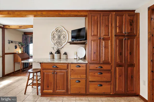 a view of a walk in closet and living room