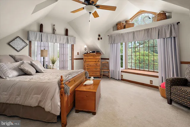 a view of a patio with a table chairs and wooden floor