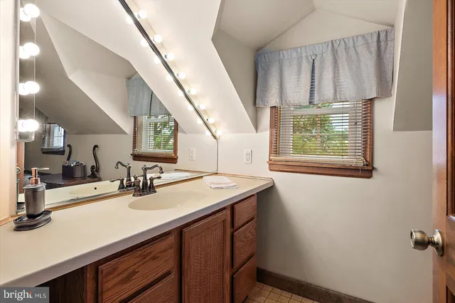 a front view of a house with swimming pool having outdoor seating