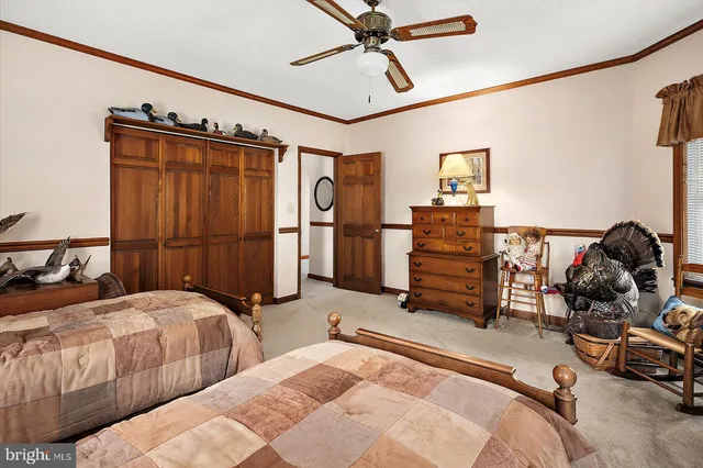 an aerial view of a house with a lake view