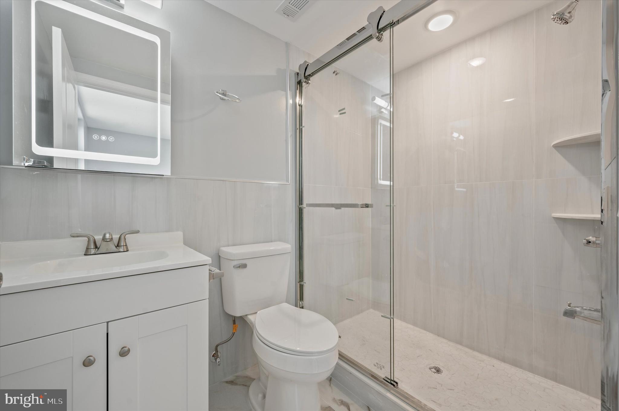2405 Ridge Avenue, Unit 3 Philadelphia, PA 19121 - Photo 11 of 11 a bathroom with a sink toilet and shower