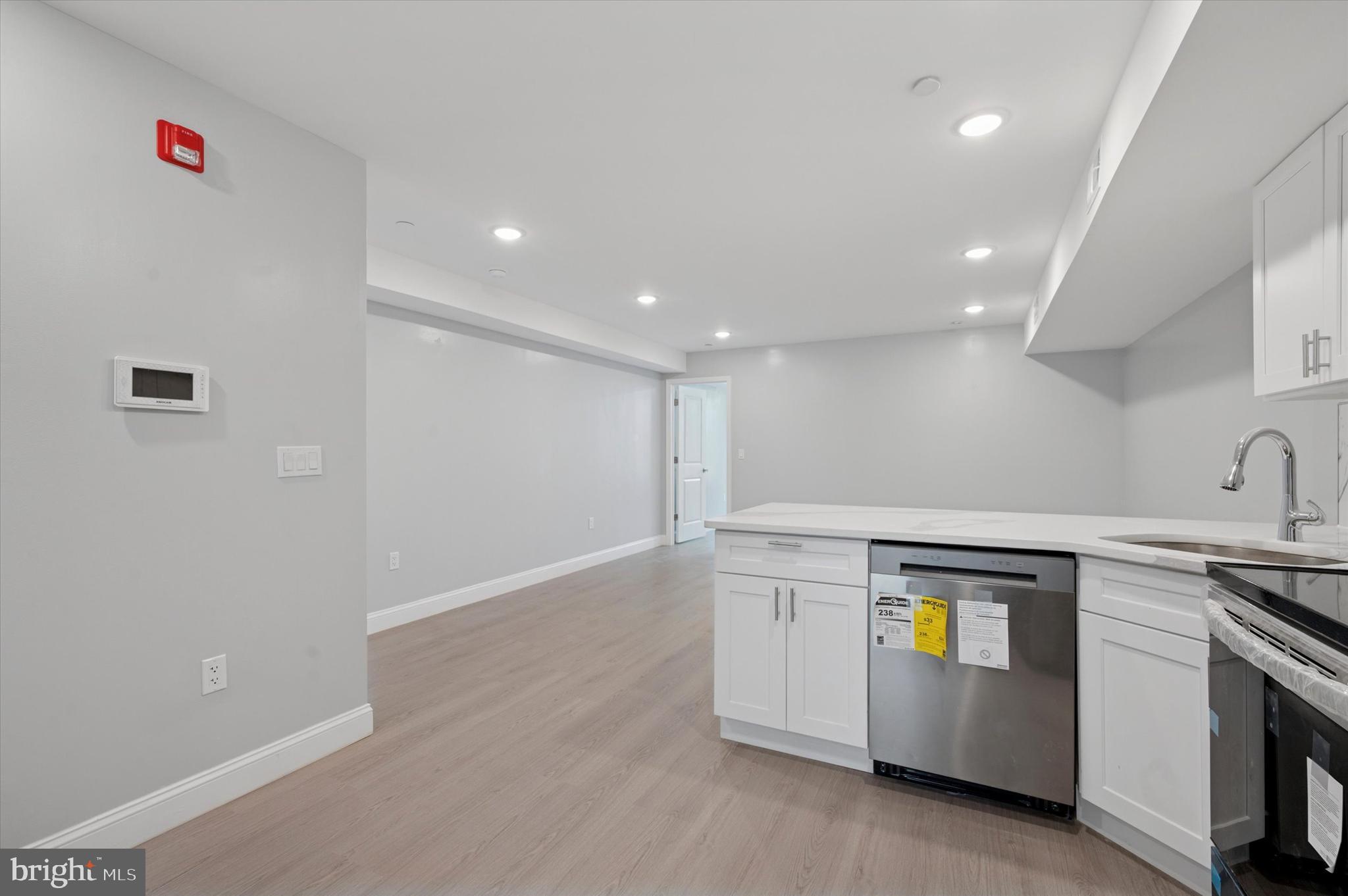 2405 Ridge Avenue, Unit 3 Philadelphia, PA 19121 - Photo 4 of 11 a view of cabinets a sink and a stove in a room