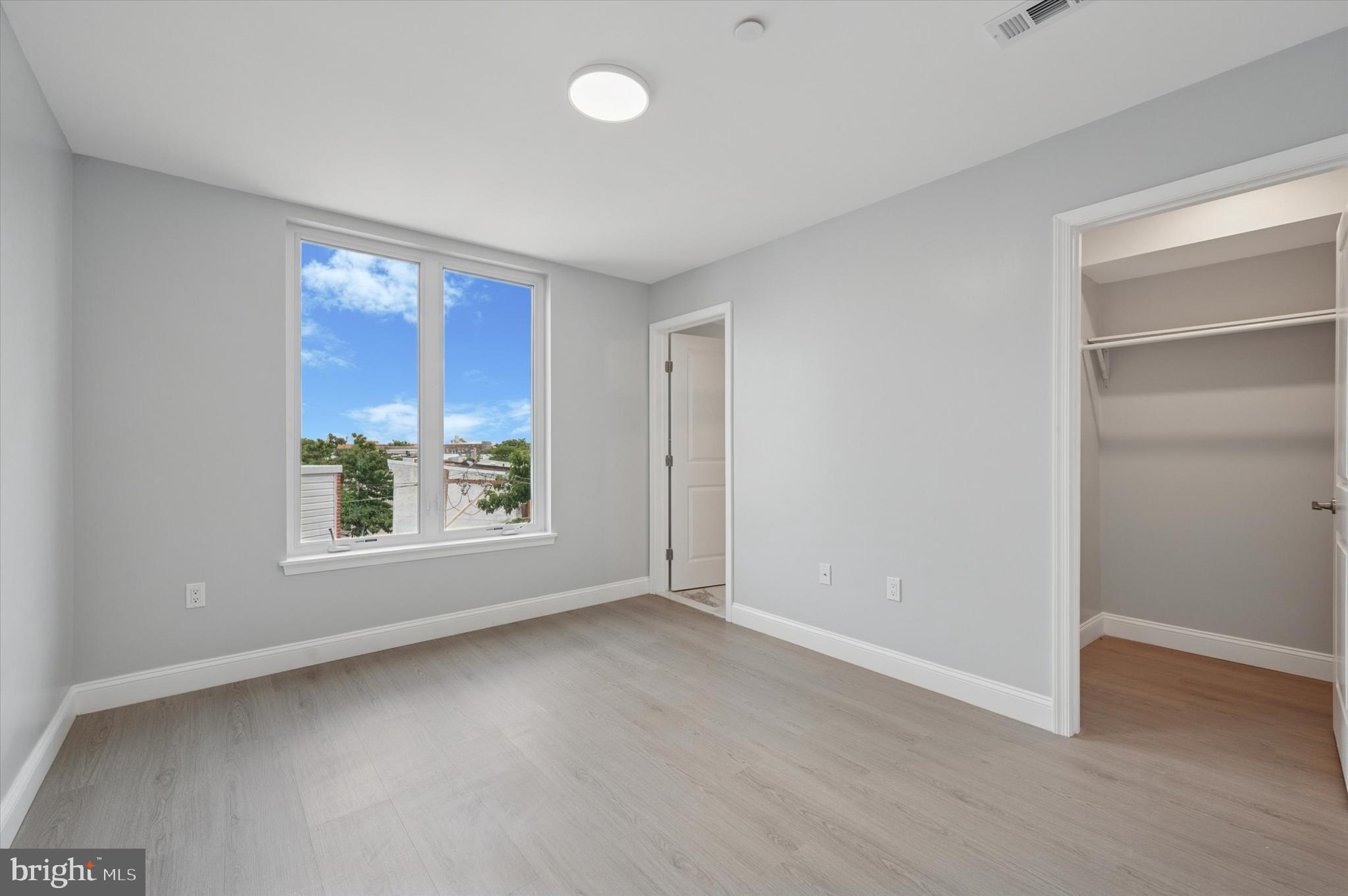 2405 Ridge Avenue, Unit 3 Philadelphia, PA 19121 - Photo 8 of 11 an empty room with windows