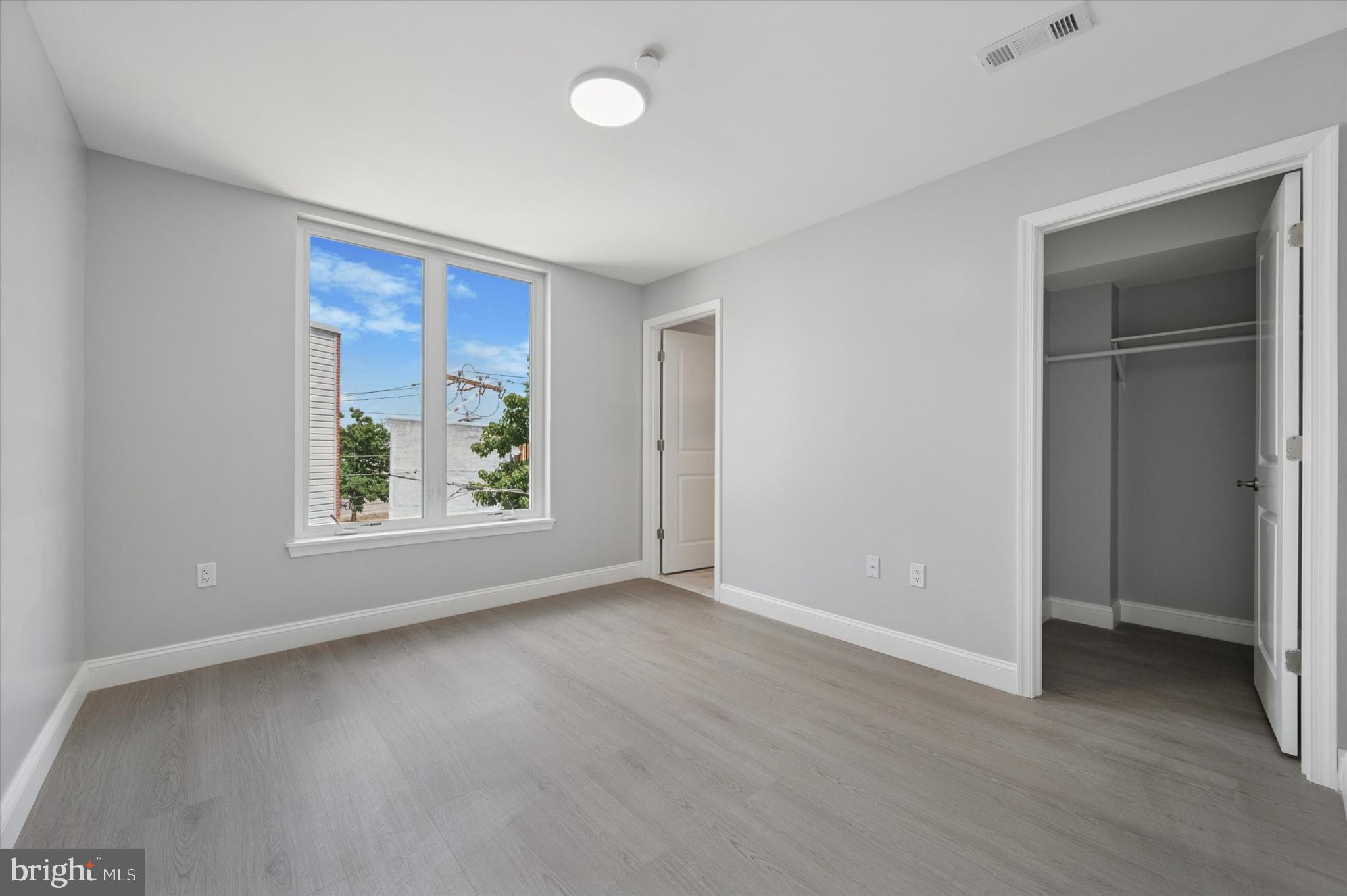 2405 Ridge Avenue, Unit 3 Philadelphia, PA 19121 - Photo 9 of 11 an empty room with windows and closet