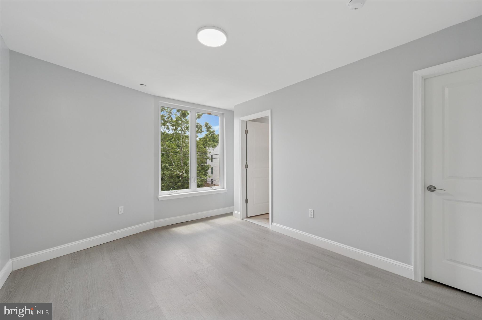 2405 Ridge Avenue, Unit 3 Philadelphia, PA 19121 - Photo 10 of 11 a view of an empty room with a window