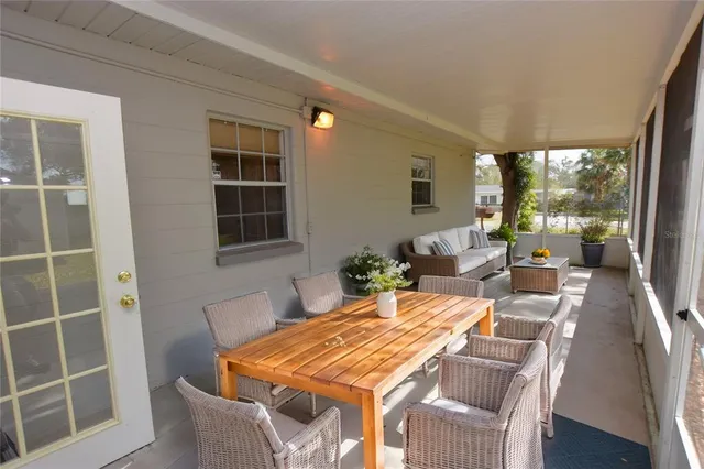 a view of a dining room with furniture window and outside view
