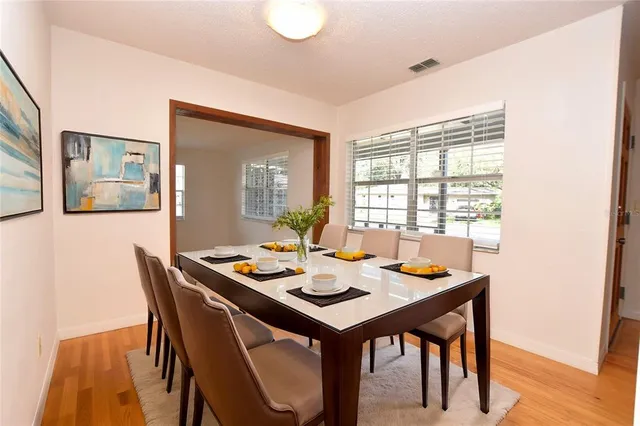a dining room with furniture and window