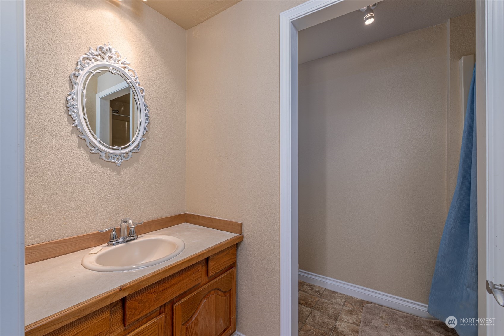 10676 13th Road Northwest Quincy, WA 98848 - Photo 11 of 34 a bathroom with a granite countertop sink and a mirror