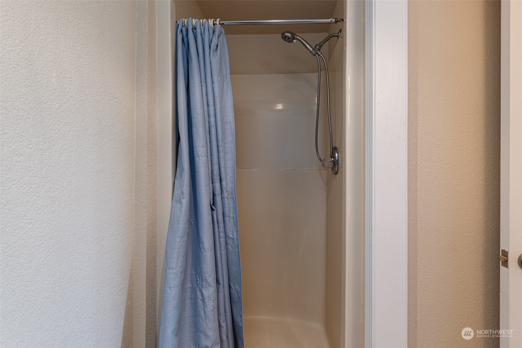 10676 13th Road Northwest Quincy, WA 98848 - Photo 12 of 34 a bathroom with a shower and a door