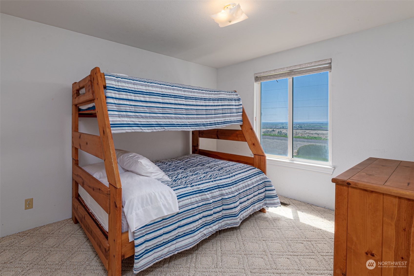 10676 13th Road Northwest Quincy, WA 98848 - Photo 13 of 34 a bedroom with a bed and a window