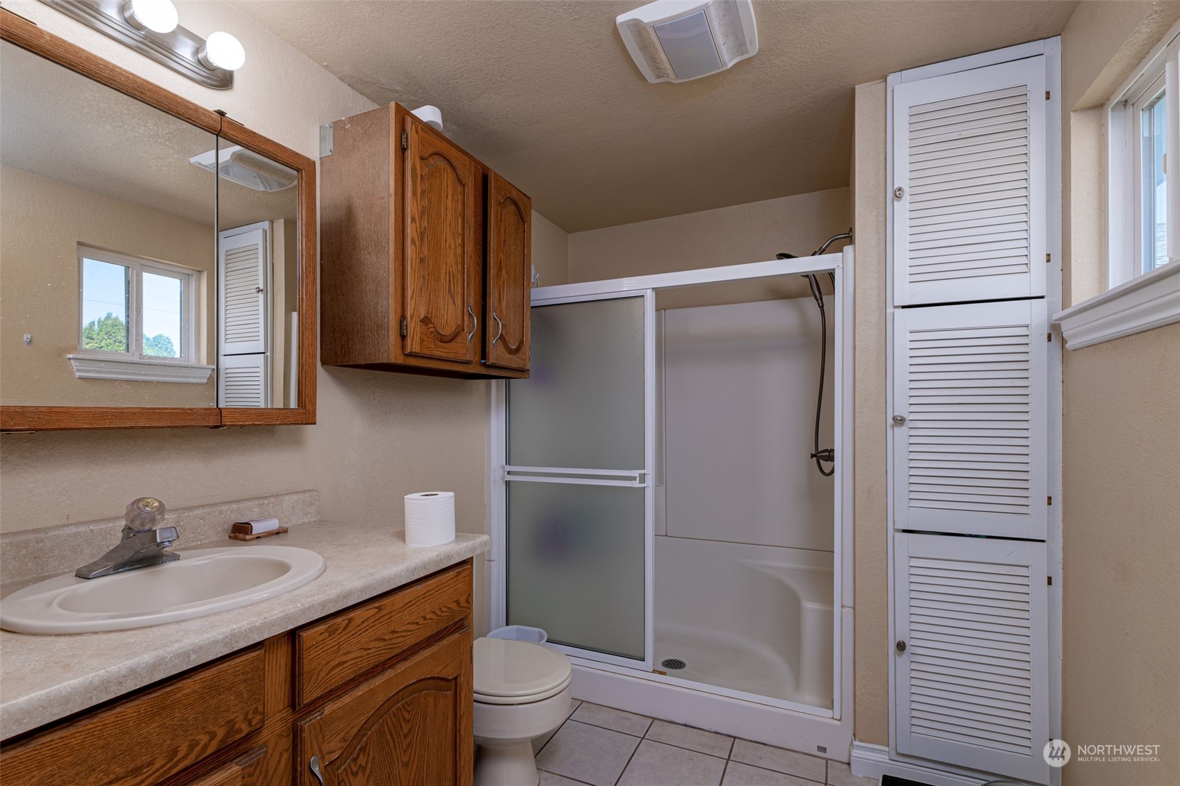 10676 13th Road Northwest Quincy, WA 98848 - Photo 17 of 34 a bathroom with a granite countertop sink toilet and shower