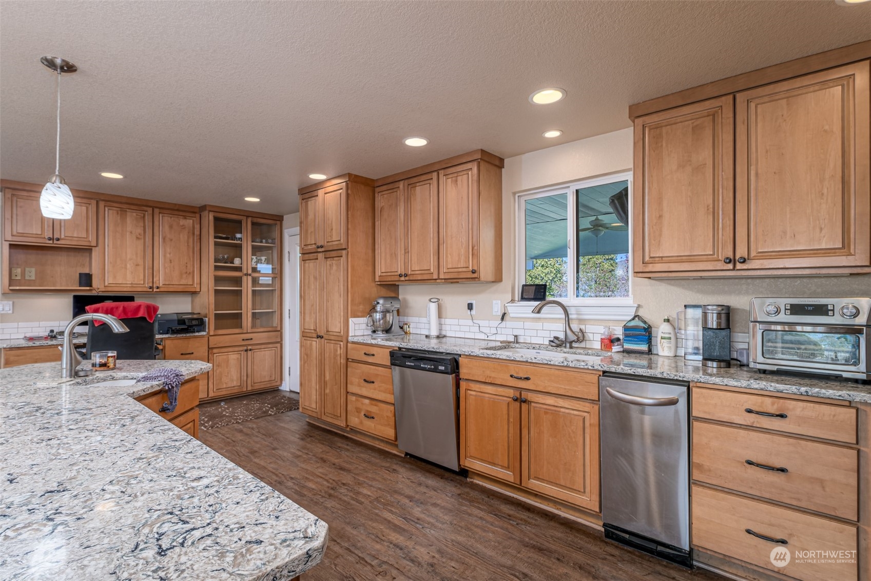 10676 13th Road Northwest Quincy, WA 98848 - Photo 18 of 34 a kitchen with granite countertop a sink and cabinets