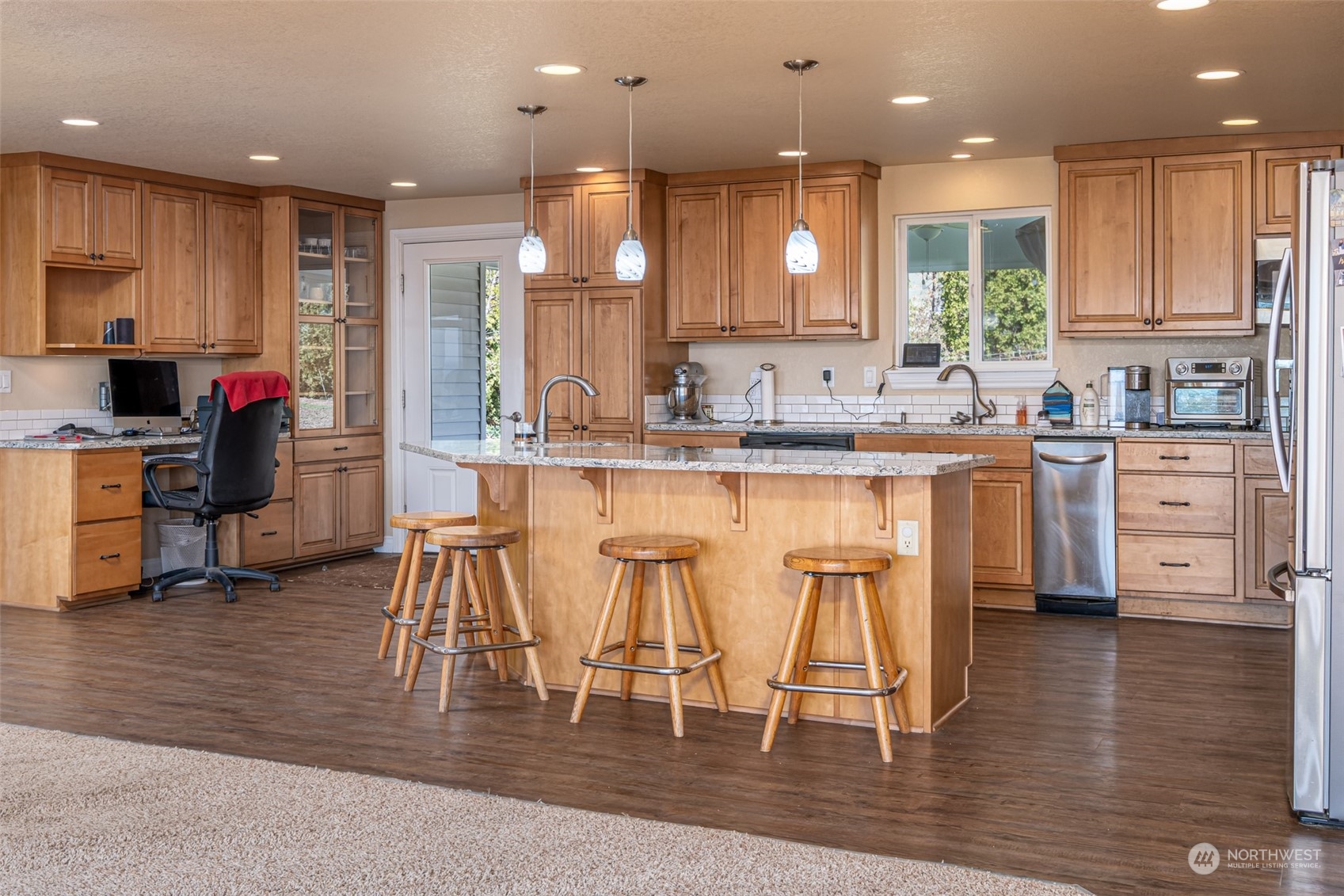 10676 13th Road Northwest Quincy, WA 98848 - Photo 5 of 34 a kitchen with stainless steel appliances granite countertop a stove top oven a sink dishwasher and a refrigerator