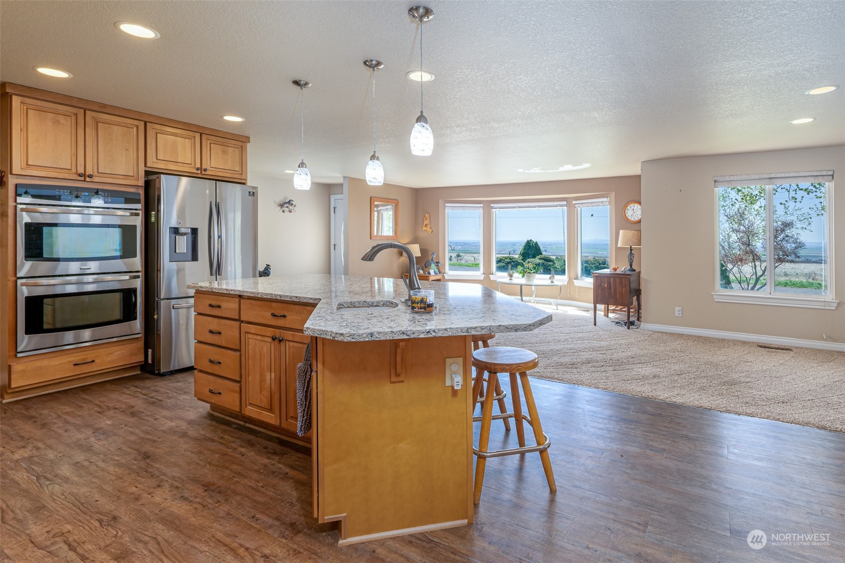 10676 13th Road Northwest Quincy, WA 98848 - Photo 6 of 34 a kitchen with stainless steel appliances granite countertop a refrigerator a stove top oven and a sink