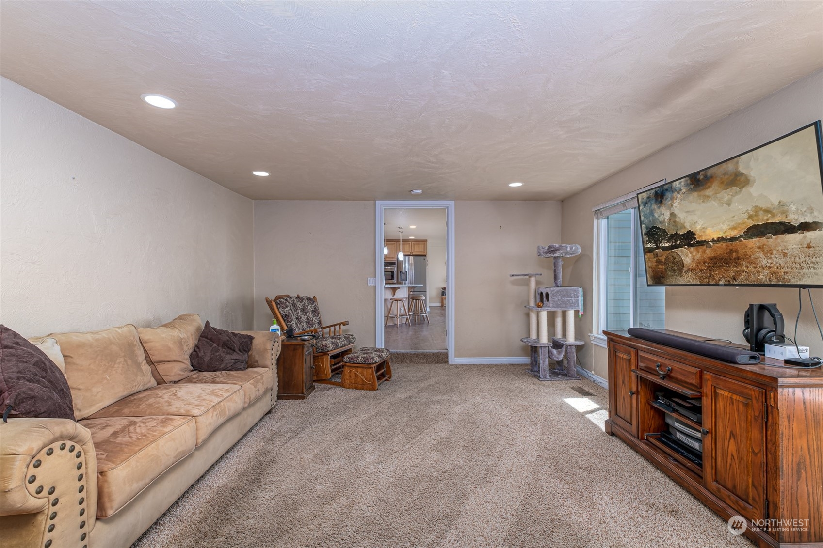 10676 13th Road Northwest Quincy, WA 98848 - Photo 9 of 34 a living room with furniture and a flat screen tv