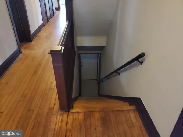 a room with window and view of an empty room