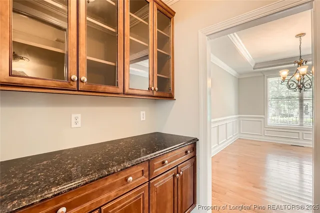 a view of a kitchen with granite countertop cabinets and a wooden floor