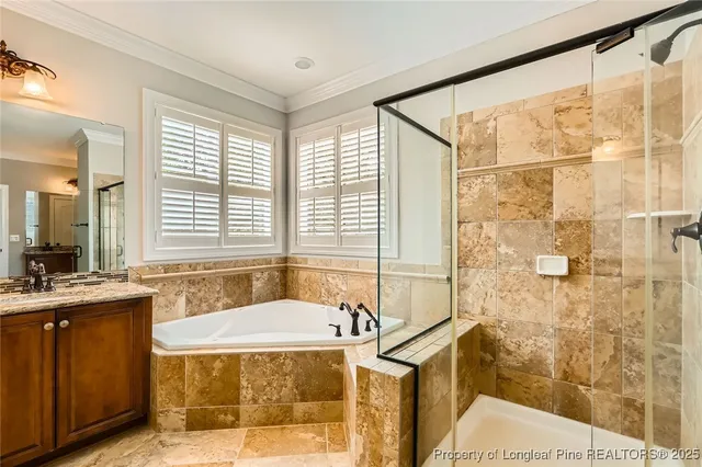 a spacious bathroom with sink shower and bathtub