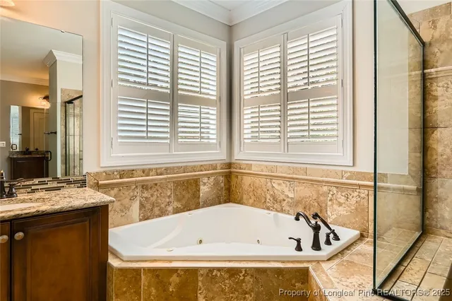 a bathroom with a bathtub and a window