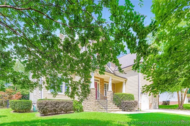 front view of a house with a yard