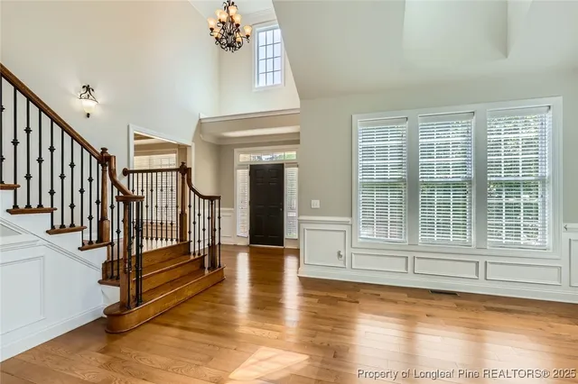 a view of an entryway with wooden floor and door