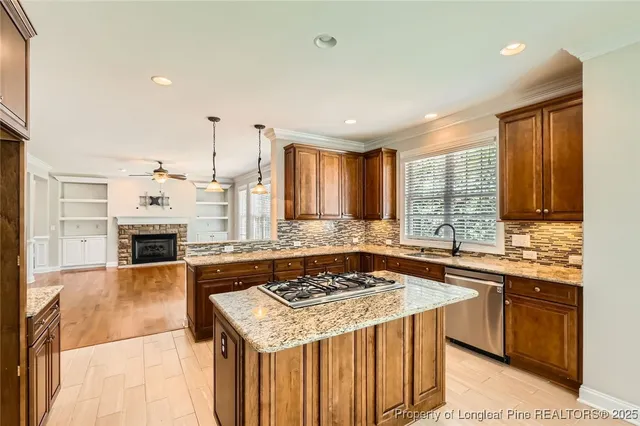 a kitchen with a stove sink and microwave