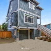 a front view of a house with garage