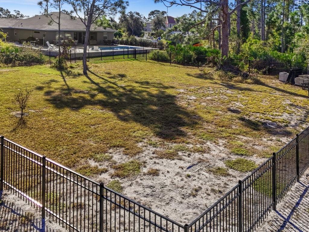 8221 Agate Street Port Charlotte, FL 33981 - Photo 15 of 50 a view of a swimming pool with a patio