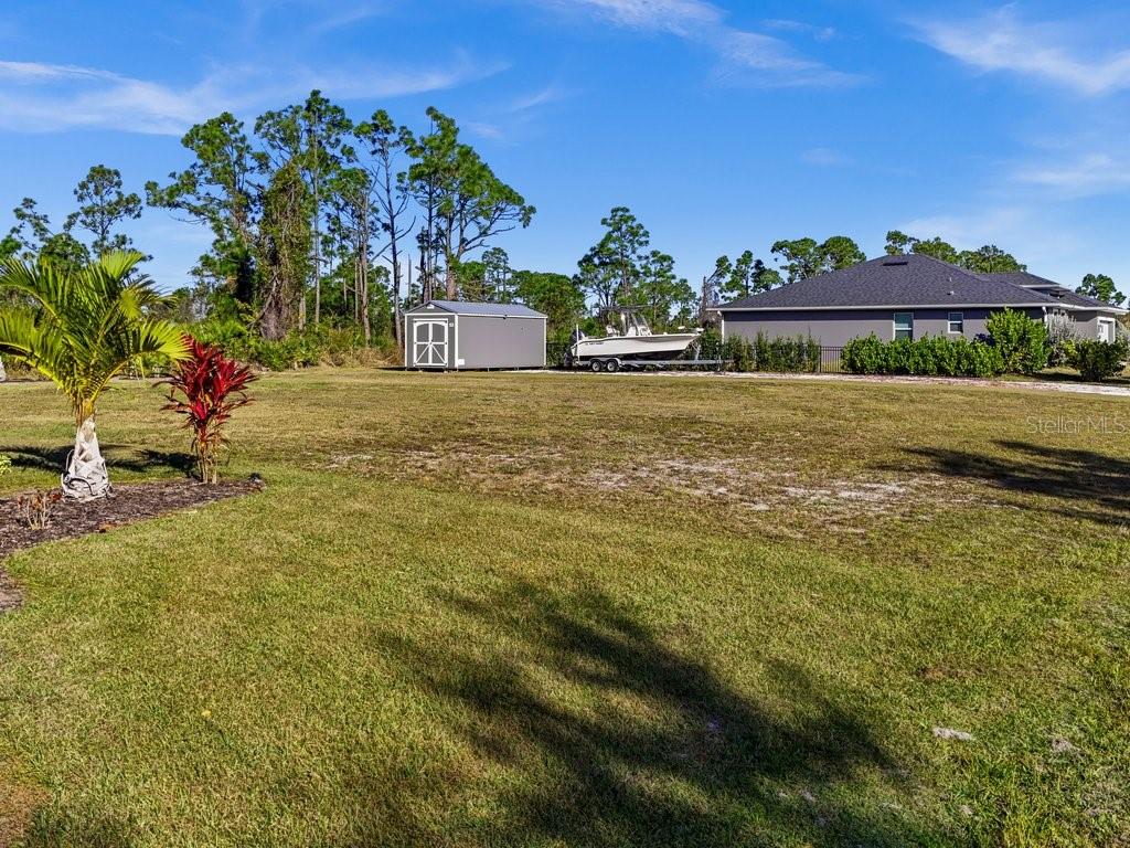 8221 Agate Street Port Charlotte, FL 33981 - Photo 17 of 50 a front view of a house with a yard
