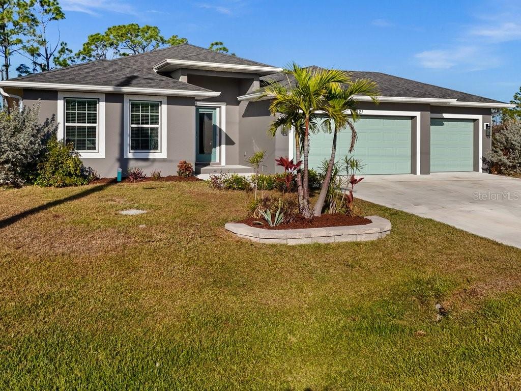 8221 Agate Street Port Charlotte, FL 33981 - Photo 2 of 50 a view of a house with fountain and entertaining space