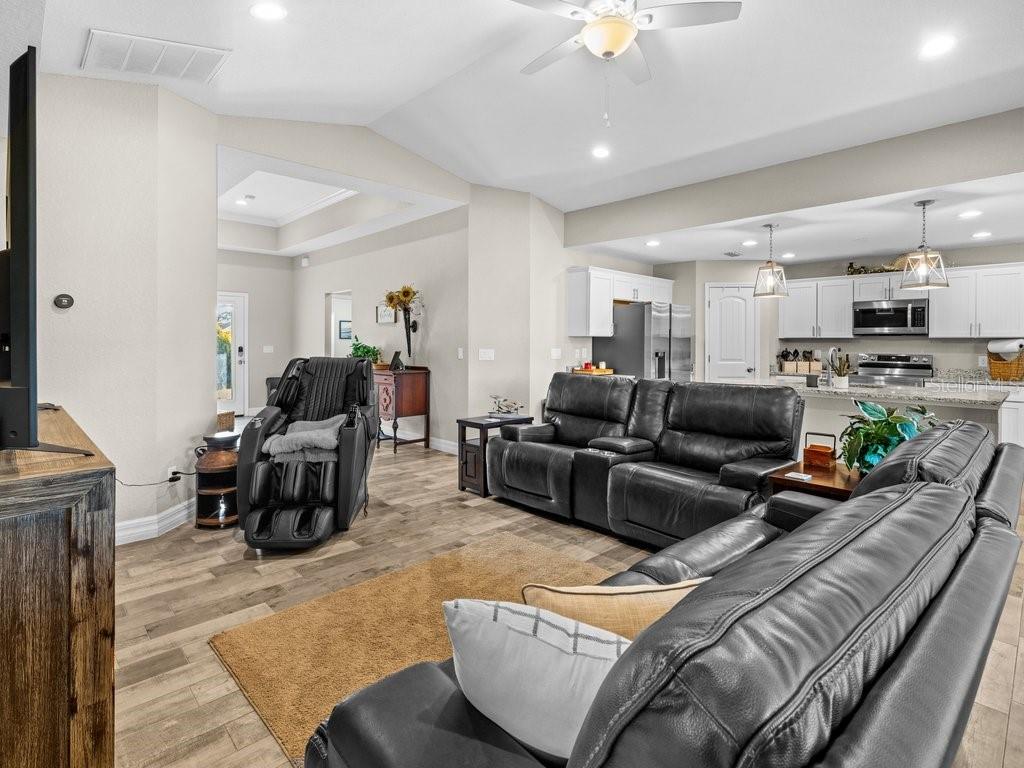 8221 Agate Street Port Charlotte, FL 33981 - Photo 21 of 50 a living room with furniture and a fireplace