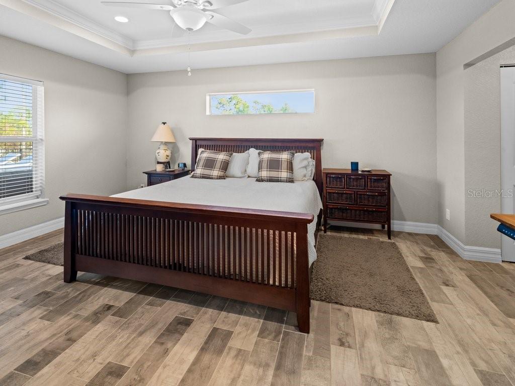 8221 Agate Street Port Charlotte, FL 33981 - Photo 29 of 50 a bedroom with a bed and a window