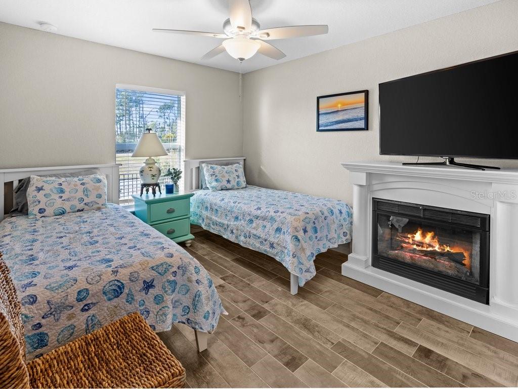 8221 Agate Street Port Charlotte, FL 33981 - Photo 34 of 50 a bedroom with two beds and a television