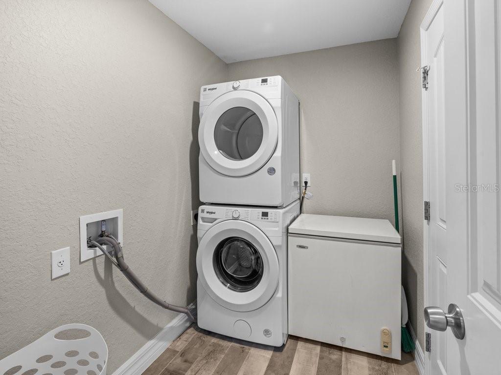 8221 Agate Street Port Charlotte, FL 33981 - Photo 38 of 50 a utility room with dryer and washer