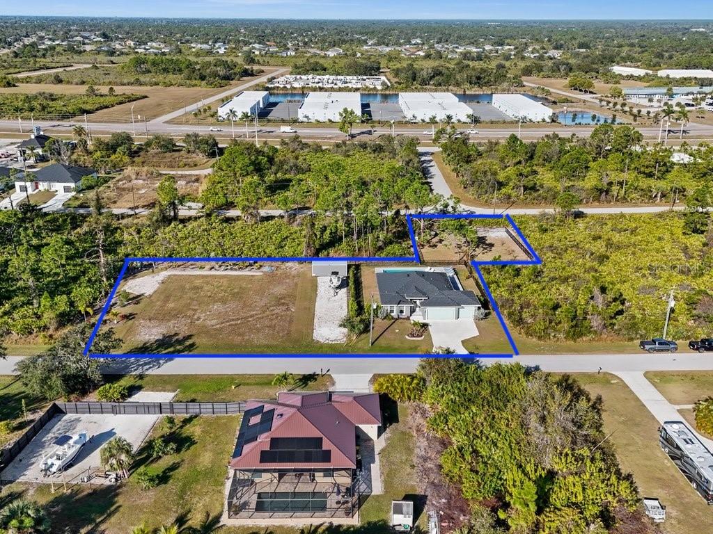 8221 Agate Street Port Charlotte, FL 33981 - Photo 4 of 50 an aerial view of residential houses with outdoor space