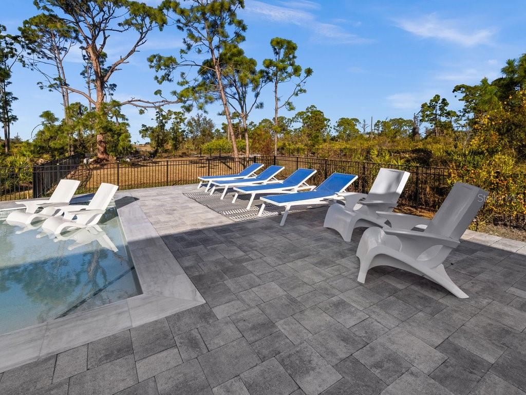 8221 Agate Street Port Charlotte, FL 33981 - Photo 41 of 50 a view of a terrace with chairs