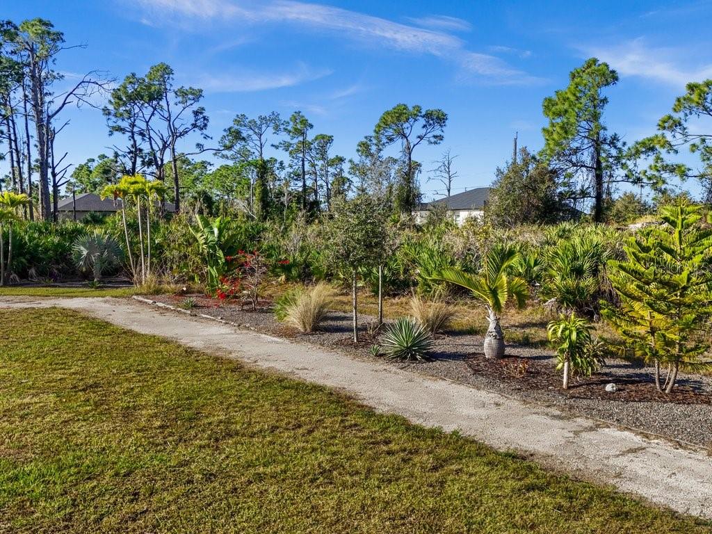 8221 Agate Street Port Charlotte, FL 33981 - Photo 46 of 50 a view of a garden with an outdoor seating