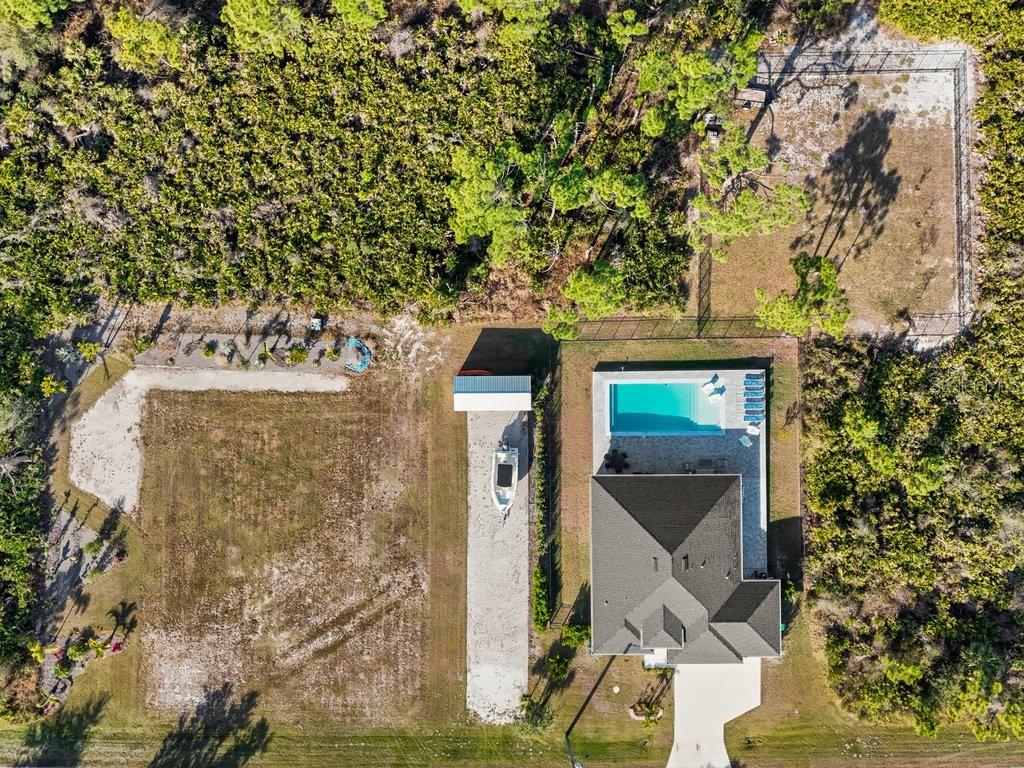 8221 Agate Street Port Charlotte, FL 33981 - Photo 47 of 50 front view of a house with a tree