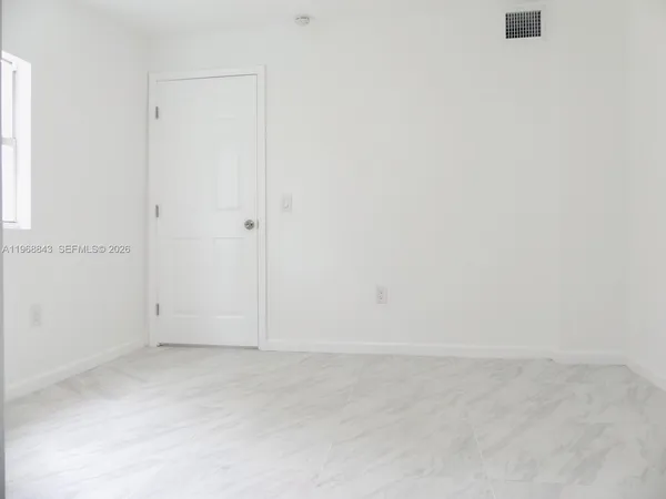 an empty room with windows