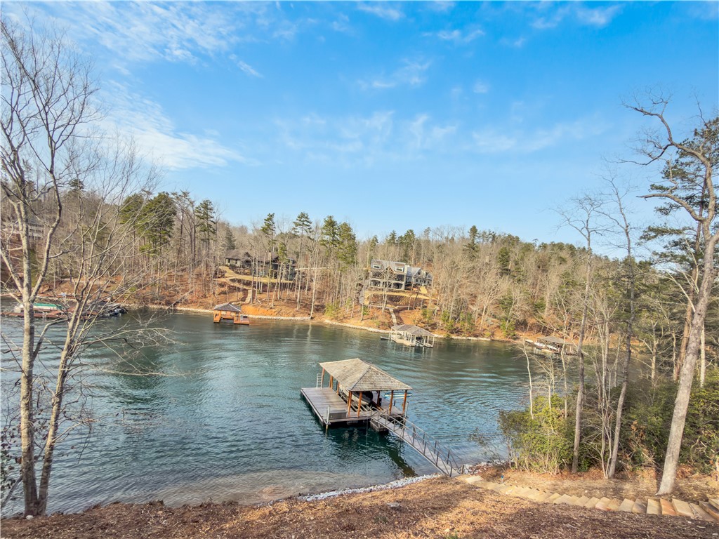 127 Crosswind Court Sunset, SC 29685 - Photo 41 of 49 This tranquil lakeside property offers serene water views and a private boat dock, perfect for outdoor enthusiasts.