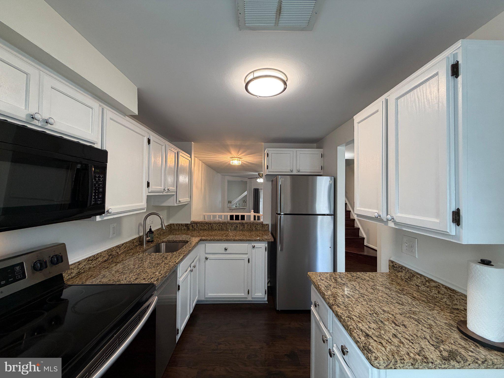 2121 Whisper Way Reston, VA 20191 - Photo 6 of 61 Modern kitchen with sleek finishes.