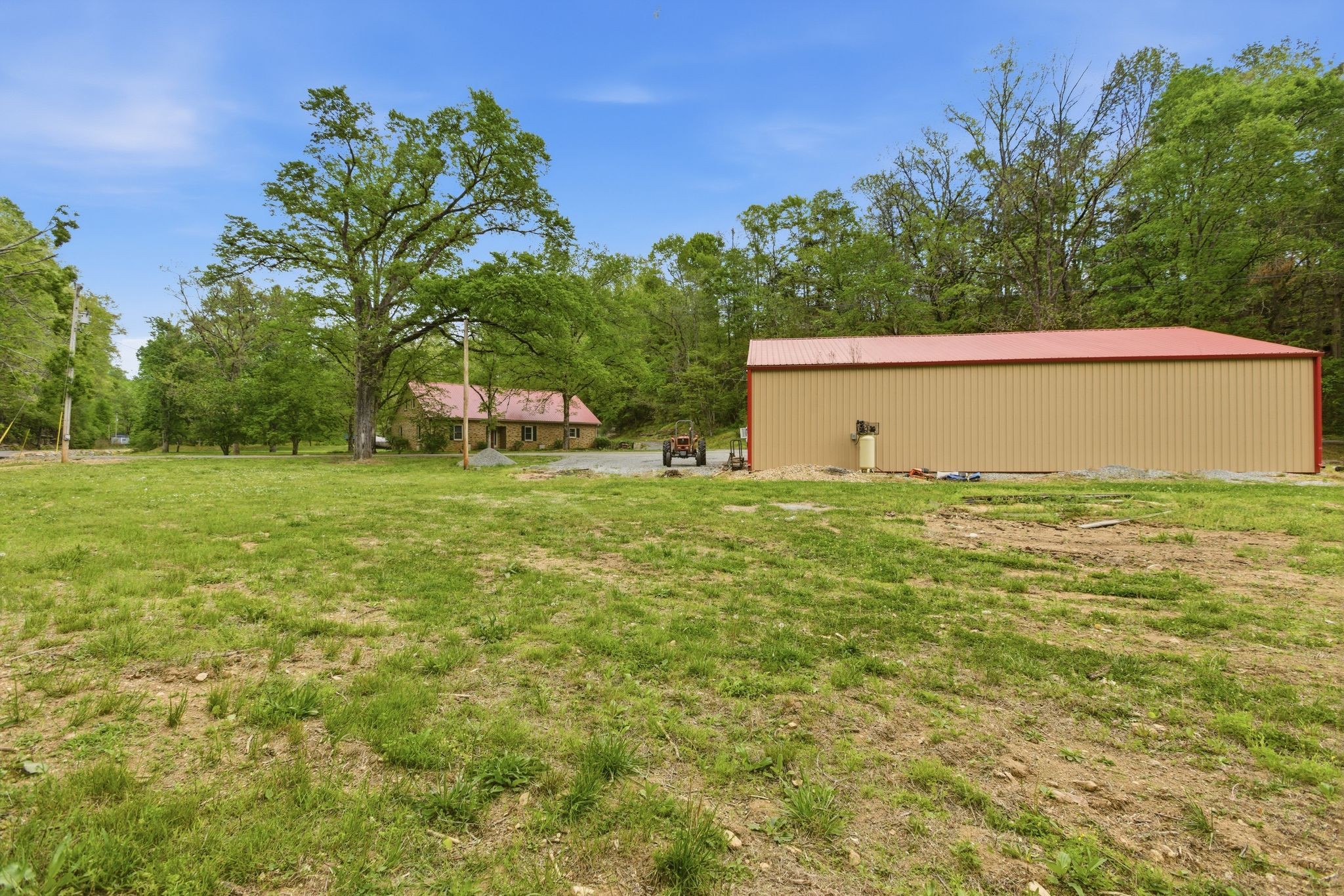 580 Defeated Creek Road Centerville, TN 37033 - Photo 52 of 71 a view of a house with a yard